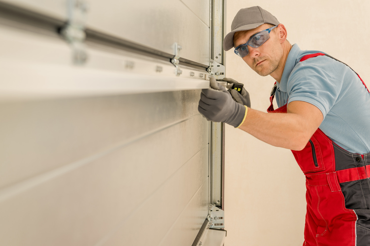 expert fixing garage door